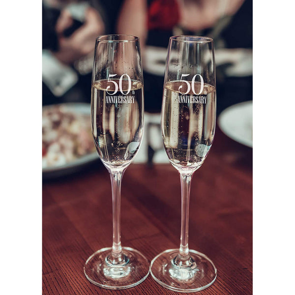 Raise a Glass With New 50th Champagne Flutes 