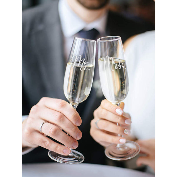 https://www.sweetzerandorange.com/cdn/shop/products/935Mr.andMrs.ChampagneGlasses3_600x.jpg?v=1643027433